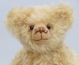 Walter is made from gorgeous dense, wavy, blonde German mohair and coordinating beige wool felt paw pads. Walter has gently coloured and painted eyes, a pert little nose carefully embroidered from a muted blend of brown and beige threads and the sweetest smile