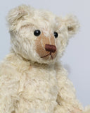 Warburton is a very sweet and loving classical, traditional mohair artist teddy bear by Barbara Ann Bears, he is 17 inches (43cm) tall and is 13 inches (33cm) sitting. Warburton is made from distressed creamy white mohair with beige wool felt paw pads, reproduction black boot button eyes and an embroidered brown nose