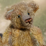 Wee Jimmy is a very handsome & subtly colourful, traditional, one of a kind artist teddy bear, in hand dyed mohair by Barbara Ann Bears, he stands 8.5 inches (21 cm) tall and is 6 inches (15 cm) sitting. He is made from a fairly short and sparse German mohair hand-dyed in natural hues green, gold, umber, blue and grey
