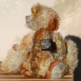 Wee Jimmy is a very handsome & subtly colourful, traditional, one of a kind artist teddy bear, in hand dyed mohair by Barbara Ann Bears, he stands 8.5 inches (21 cm) tall and is 6 inches (15 cm) sitting. He is made from a fairly short and sparse German mohair hand-dyed in natural hues green, gold, umber, blue and grey