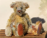 Wee Jimmy is a very handsome & subtly colourful, traditional, one of a kind artist teddy bear, in hand dyed mohair by Barbara Ann Bears, he stands 8.5 inches (21 cm) tall and is 6 inches (15 cm) sitting. He is made from a fairly short and sparse German mohair hand-dyed in natural hues green, gold, umber, blue and grey