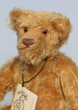 Wilfred is made from a wonderful antique gold mohair, it is a medium length, and a little fluffy and distressed, it's not a type of mohair that is made anymore which makes him just that little bit extra special. Wilfred has gorgeous amber glass eyes, a splendid, carefully embroidered brown nose and a relaxed and demure expression. Wilfred was the first of our bears to have a beard, we were about to trim it off but thought it rather suited him