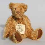 Wilfred is a very sweet and friendly artist teddy bear in gorgeous mohair by Barbara Ann Bears, he is 12 inches/30 cm tall and is 8.5 inches/21 cm sitting. Wilfred is made from a wonderful antique gold mohair with brown wool felt paw pads and gorgeous amber glass eyes. Wilfred has a carefully embroidered brown nose