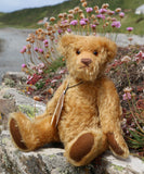 Wilfred is a very sweet and friendly artist teddy bear in gorgeous mohair by Barbara Ann Bears, he is 12 inches/30 cm tall and is 8.5 inches/21 cm sitting. Wilfred is made from a wonderful antique gold mohair with brown wool felt paw pads and gorgeous amber glass eyes. Wilfred has a carefully embroidered brown nose