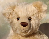 Willoughby is a sweet and cuddly, traditional one of a kind, artist teddy bear made in splendid German mohair by Barbara Ann Bears, he stands 18.5 inches (47cm) tall and is 13.5 inches (34cm) sitting. He is made from dense, blond, straight pile, German mohair with beige wool-felt paw pads & hand painted beautiful eyes