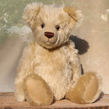 Willoughby is a sweet and cuddly, traditional one of a kind, artist teddy bear made in splendid German mohair by Barbara Ann Bears, he stands 18.5 inches (47cm) tall and is 13.5 inches (34cm) sitting. He is made from dense, blond, straight pile, German mohair with beige wool-felt paw pads & hand painted beautiful eyes