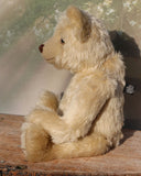 Willoughby is a sweet and cuddly, traditional one of a kind, artist teddy bear made in splendid German mohair by Barbara Ann Bears, he stands 18.5 inches (47cm) tall and is 13.5 inches (34cm) sitting. He is made from dense, blond, straight pile, German mohair with beige wool-felt paw pads & hand painted beautiful eyes