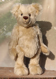 Willoughby is a sweet and cuddly, traditional one of a kind, artist teddy bear made in splendid German mohair by Barbara Ann Bears, he stands 18.5 inches (47cm) tall and is 13.5 inches (34cm) sitting. He is made from dense, blond, straight pile, German mohair with beige wool-felt paw pads & hand painted beautiful eyes