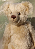 Willoughby is a sweet and cuddly, traditional one of a kind, artist teddy bear made in splendid German mohair by Barbara Ann Bears, he stands 18.5 inches (47cm) tall and is 13.5 inches (34cm) sitting. He is made from dense, blond, straight pile, German mohair with beige wool-felt paw pads & hand painted beautiful eyes