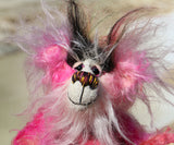 Yummy YumYum is a comical, fabulously pink, one of a kind, artist bear in beautiful hand dyed mohair and faux fur by Barbara-Ann Bears. Yummy YumYum stands 7.5 inches (19 cm) tall and is 6 inches (15 cm) sitting, this doesn't include her wild hair which adds another 3 inches (7.5 cm) to those measurements.