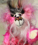 Yummy YumYum is a comical, fabulously pink, one of a kind, artist bear in beautiful hand dyed mohair and faux fur by Barbara-Ann Bears. Yummy YumYum stands 7.5 inches (19 cm) tall and is 6 inches (15 cm) sitting, this doesn't include her wild hair which adds another 3 inches (7.5 cm) to those measurements.