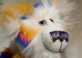 Zebedee has large, beautiful, hand painted glass eyes with hand coloured eyelids, he has a carefully embroidered nose that incorporates all of his colours and a sweet, thoughtful smile