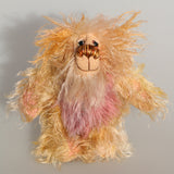 Ziggy Scrumdumpling a lovable, colourful, little one of a kind, hand dyed mohair artist bear by Barbara-Ann Bears, he is one of our smallest bears, he stands just 5.5 inches/14 cm tall and is 4.5 inches/11 cm sitting. He's mainly a scruffy sparse mohair which Barbara has dyed in delicate shades of beige, cream and peach