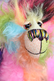 Zoiks! is a rather colourful and comical one of a kind artist bear in beautiful, fluffy hand dyed mohair and faux fur by Barbara Ann Bears. Zoiks! stands 10.5 inches( 33 cm) tall and is 8 inches (20 cm) sitting, this doesn't include his plumes of hair which add another 3 inches/ 7.5cm.