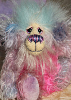 Pru is a beautiful, happy and gently colourful, one of a kind, hand dyed mohair little artist teddy bear by Barbara-Ann Bears she stands just under 5 inches/13 cm tall. Pru is made from several different mohairs that Barbara has dyed pink, lilac and blue together with a soft sky blue faux fur, velvet paw pads, hand painted eyes with eyelids, a beautifully embroidered nose and a sweet smile