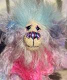 Pru has beautiful, hand painted eyes with eyelids, a splendid nose embroidered with individual threads to compliment her colouring and she has a sweet, friendly smile. Pru's face is a very long and wispy cream mohair with subtle lilac tipping, the fronts of her ears are a sparse, twirly mohair hand dyed blue and on top of her head she has a mop of very dense and soft sky blue faux fur