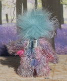 Pru is a beautiful, happy and gently colourful, one of a kind, hand dyed mohair little artist teddy bear by Barbara-Ann Bears she stands just under 5 inches/13 cm tall. Pru is made from several different mohairs that Barbara has dyed pink, lilac and blue together with a soft sky blue faux fur, velvet paw pads, hand painted eyes with eyelids, a beautifully embroidered nose and a sweet smile
