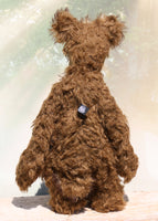 Wilbur is a magnificent and very handsome, one of a kind, artist teddy bear by Barbara-Ann Bears in gorgeous and luxurious mohairs, he stands 23 inches/ 59 cm tall. Wilbur is made from a very long wildly distressed mid brown mohair together with a very, very long (and expensive) tousled beige mohair with brown tipping. Here he is standing facing away from the camera