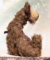Wilbur is a magnificent and very handsome, one of a kind, artist teddy bear by Barbara-Ann Bears in gorgeous and luxurious mohairs, he stands 23 inches/ 59 cm tall. Wilbur is made from a very long wildly distressed mid brown mohair together with a very, very long (and expensive) tousled beige mohair with brown tipping. Here is the profile  of him sitting, showing his Barbara Ann Bear/unsuitable for children under 14 label