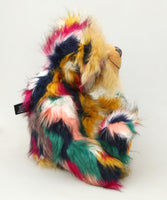 Benedict is a gentle and loving one of a kind, artist bear by Barbara-Ann Bears in luxurious mohair and beautifully colourful faux fur, he stands 17.5 inches/28 cm tall.  Benedict is made from faux fur in green, yellow ochre, red, cream and black, with a luxurious, long gold fluffy mohair and gold felt paw pads