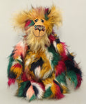 Benedict is a gentle and loving one of a kind, artist bear by Barbara-Ann Bears in luxurious mohair and beautifully colourful faux fur, he stands 17.5 inches/28 cm tall.  Benedict is made from faux fur in green, yellow ochre, red, cream and black, with a luxurious, long gold fluffy mohair and gold felt paw pads