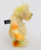 Benjamin Bloom is a wonderfully happy and gorgeously green and yellow one of a kind artist teddy bear by Barbara-Ann Bears he stands 10 inches/25cm tall Benjamin is made from yellow, green and orange long and fluffy hand dyed mohair, with matching hand dyed paw pads, hand painted eyes and a beautifully embroidered nose