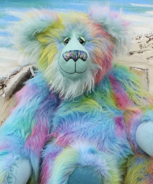 Bluebell is a very large, cuddly and beautifully coloured, 26 inch tall one of a kind, artist bear by Barbara Ann Bears in luxurious fluffy faux fur and mohair.
Bluebell is made from the most gorgeous and luxurious faux fur and mohair, mainly a dense, long and fluffy faux fur in sky blue with delicate magenta, lilac, lime and amber tipping. Her face, the fronts of her ears and the underside of her tail are a long, fluffy pale turquoise mohair. Bluebell has blue velvet paw pads that complement her mohair per