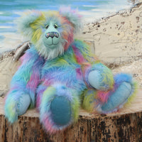 Bluebell is a very large, cuddly and beautifully coloured, 26 inch tall one of a kind, artist bear by Barbara Ann Bears in luxurious fluffy faux fur and mohair.
Bluebell is made from the most gorgeous and luxurious faux fur and mohair, mainly a dense, long and fluffy faux fur in sky blue with delicate magenta, lilac, lime and amber tipping. Her face, the fronts of her ears and the underside of her tail are a long, fluffy pale turquoise mohair. Bluebell has blue velvet paw pads that complement her mohair per