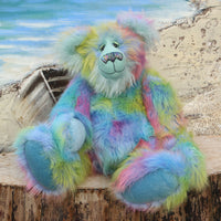 Bluebell is a very large, cuddly and beautifully coloured, 26 inch tall one of a kind, artist bear by Barbara Ann Bears in luxurious fluffy faux fur and mohair.
Bluebell is made from the most gorgeous and luxurious faux fur and mohair, mainly a dense, long and fluffy faux fur in sky blue with delicate magenta, lilac, lime and amber tipping. Her face, the fronts of her ears and the underside of her tail are a long, fluffy pale turquoise mohair. Bluebell has blue velvet paw pads that complement her mohair per