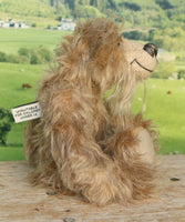 Boswell sitting showing his profile.
Boswell is a charming and very friendly, one of a kind, artist bear by Barbara-Ann Bears in wonderful flecked grey mohair.
Boswell stands 8 inches/20cm tall