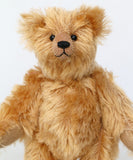 Bruce Fettlewell is a cuddly little traditional one of a kind artist bear in antique gold German mohair with a soft texture on a light background