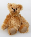 Bruce Fettlewell is a cuddly little traditional one of a kind artist bear in antique gold German mohair with a soft texture on a light background
