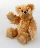 Bruce Fettlewell is a cuddly little traditional one of a kind artist bear in antique gold German mohair with a soft texture on a light background