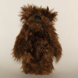 Bruno Pinehandle is a wild thing, yet a very friendly wild thing, a one of a kind, artist bear by Barbara-Ann Bears in wonderful shaggy brown mohair, he stands 12 inches/30 cm tall. He is made from a long dark brown mohair, with a longer dark brown mohair with black tipping and he has dark brown wool felt paw pads. He has beautiful hand painted glass eyes with hand coloured eyelids, a splendid nose embroidered in black cotton and a broad and cheerful smile