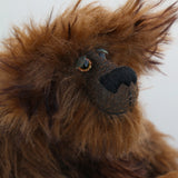 Bruno Pinehandle is a wild thing, yet a very friendly wild thing, a one of a kind, artist bear by Barbara-Ann Bears in wonderful shaggy brown mohair, he stands 12 inches/30 cm tall. He is made from a long dark brown mohair, with a longer dark brown mohair with black tipping and he has dark brown wool felt paw pads. He has beautiful hand painted glass eyes with hand coloured eyelids, a splendid nose embroidered in black cotton and a broad and cheerful smile