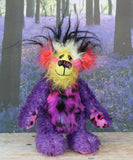 Caramba standing. Caramba is a rather colourful and comical one of a kind artist bear in beautiful purple hand dyed mohair and anmal print faux fur by Barbara Ann Bears