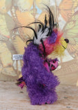 Caramba standing, side view. Caramba is a rather colourful and comical one of a kind artist bear in beautiful purple hand dyed mohair and anmal print faux fur by Barbara Ann Bears