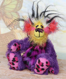 Caramba sitting. Caramba is a rather colourful and comical one of a kind artist bear in beautiful purple hand dyed mohair and anmal print faux fur by Barbara Ann Bears
