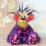 Caramba sitting. Caramba is a rather colourful and comical one of a kind artist bear in beautiful purple hand dyed mohair and anmal print faux fur by Barbara Ann Bears