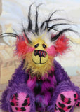 Caramba sitting. Caramba is a rather colourful and comical one of a kind artist bear in beautiful purple hand dyed mohair and anmal print faux fur by Barbara Ann Bears