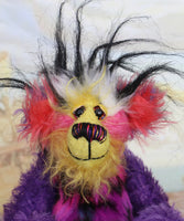 Caramba's face. Caramba is a rather colourful and comical one of a kind artist bear in beautiful purple hand dyed mohair and anmal print faux fur by Barbara Ann Bears