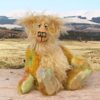 Cardamon sitting. 
Cardamon is a gentle, happy teddy bear, a beautifully coloured one of a kind, hand dyed mohair artist bear by Barbara-Ann Bears
Cardamon stands 9.5 inches/24 cm tall cm tall 