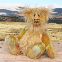 Cardamon sitting. 
Cardamon is a gentle, happy teddy bear, a beautifully coloured one of a kind, hand dyed mohair artist bear by Barbara-Ann Bears
Cardamon stands 9.5 inches/24 cm tall cm tall 