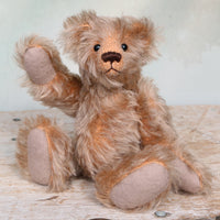 Chorley sitting and waving. Chorley is a sweet and loving traditional one of a kind artist bear in beautiful grey flecked German mohair by Barbara Ann Bears, he stands 7.5 inches/19 cm tall