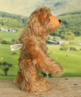 Chorley standing viewed from the side to show his profile. Chorley is a sweet and loving traditional one of a kind artist bear in beautiful grey flecked German mohair by Barbara Ann Bears, he stands 7.5 inches/19 cm tall