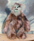 Clarence Cuddlemore a one of a kind teddy bear with light blue mohair and multi-coloured brown faux fur.