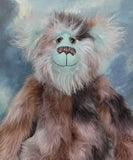Clarence Cuddlemore a one of a kind teddy bear with light blue mohair and multi-coloured brown faux fur.