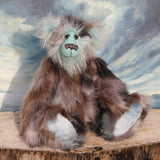 Clarence Cuddlemore a one of a kind teddy bear with light blue mohair and multi-coloured brown faux fur.