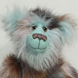 Close-up of Clarence Cuddlemore's face with light blue mohair and multi-coloured brown faux fur.