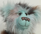 Close-up of Clarence Cuddlemore's face with light blue mohair and multi-coloured brown faux fur.